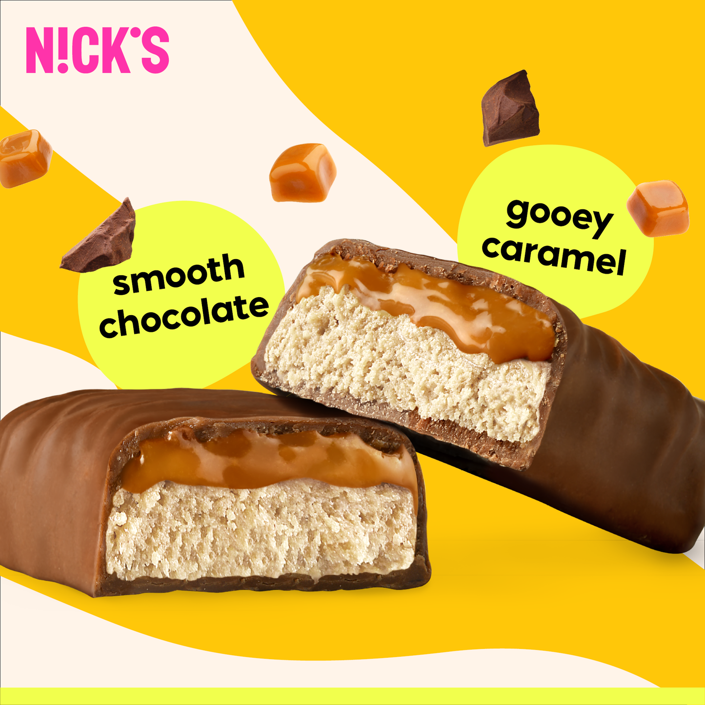 Close-up cross-section of a N!CK'S Caramel Chocolate Protein Bar, clearly showing gooey caramel over a soft protein base, coated in smooth chocolate.