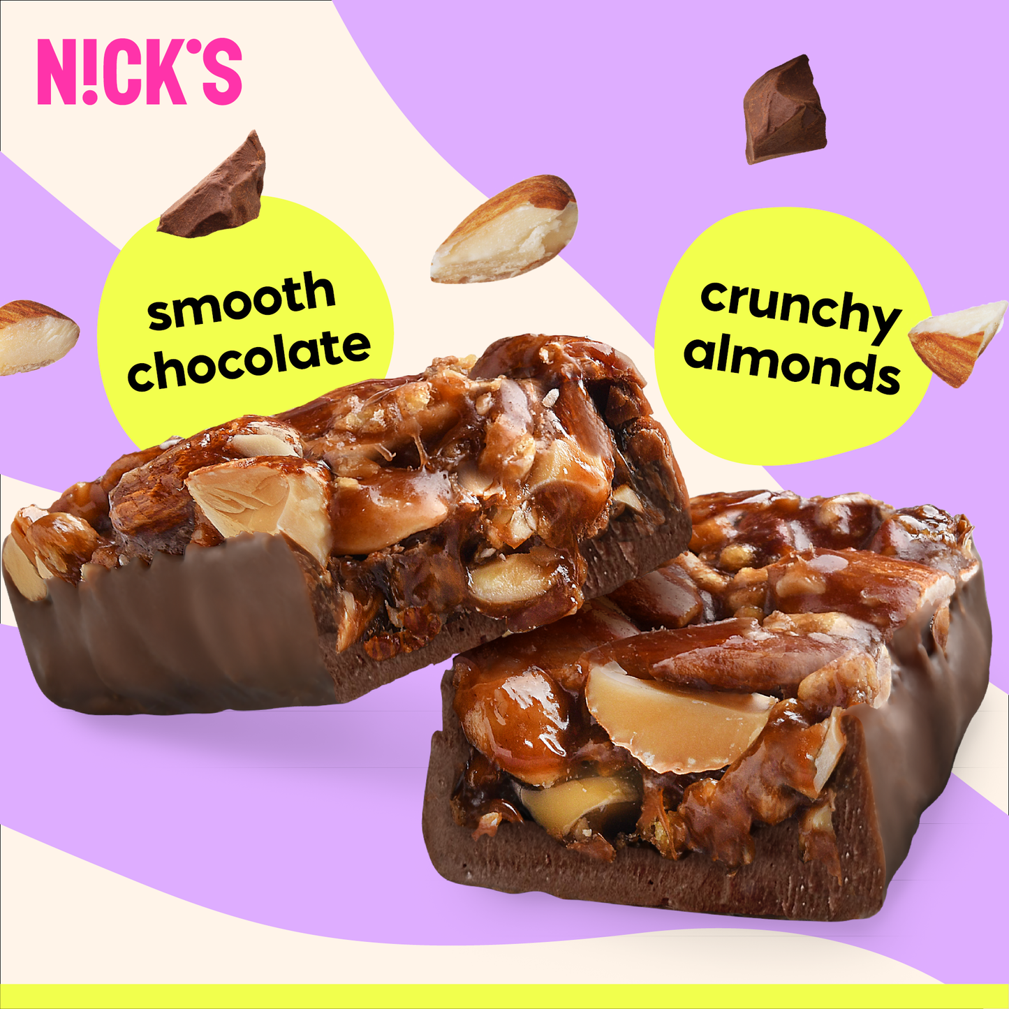 Close-up cross-section of a N!CK'S Almond Crunch Nut Bar, clearly showing crunchy almonds covered in a sweet coating and smooth chocolate.
